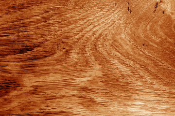 Wooden board texture in orange tone.