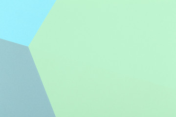 Paper green, blue, gray empty background, geometrically located. Color blank for presentations, copy space.