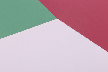 Paper green, burgundy, white empty background, geometrically located. Color blank for presentations, copy space.