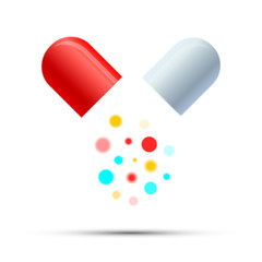 Open medicine pill with colorful active components on white