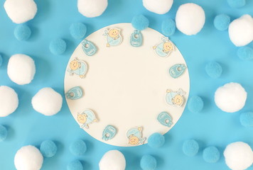 baby shower for boy background blur effect.  Pastel blue white colors party fluffy balls frame with mock up card.  Invitation, birthday, bachelorette party concept. copy space