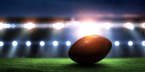 Empty night football arena in lights