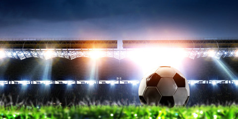 Empty night football arena in lights