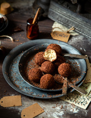 homemade truffle candy in two metal vintage plates with chocolate flakes
