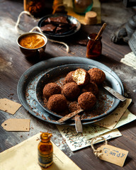 homemade truffle candy in two metal vintage plates with chocolate flakes