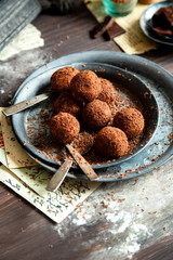 homemade truffle candy in two metal vintage plates with chocolate flakes