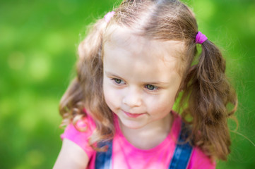 Portrait of a happy liitle girl with blue eyes close-up