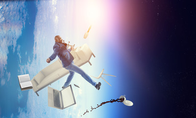 Businessman jumping in gravity. Mixed media