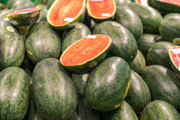 Fresh healthy fruits on shelves in supermarket