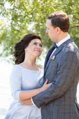 close up of happy newly married couple man and woman looking at each other with tenderness