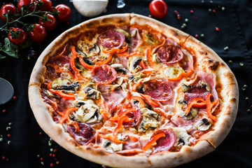 tasty italian capricciosa pizza with fresh ingredients