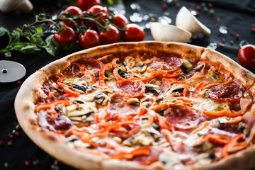 tasty italian capricciosa pizza with fresh ingredients