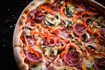 tasty italian capricciosa pizza with fresh ingredients