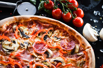 tasty italian capricciosa pizza with fresh ingredients