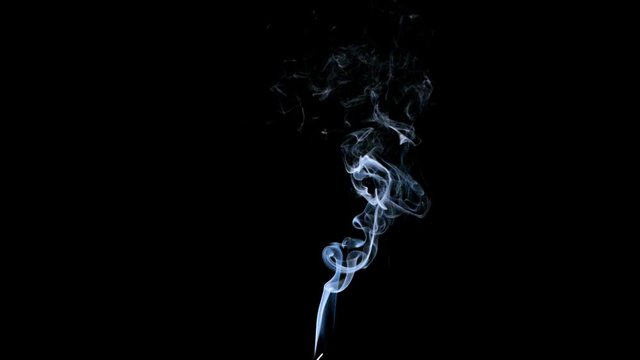 Thin Flexible Trickle of Smoke. Graceful Bends of the Blue Smoke. Natural Colorful smoke rises up and spins into graceful spirals. Footage is perfect for the layer with different blending modes.