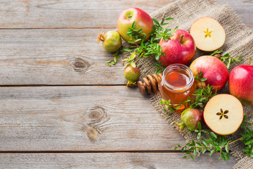 Rosh Hashana, jewish new year holiday concept, honey, apple, pomegranate