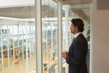 Fototapeta premium Businessman having coffee in the conference room at office