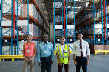 Obraz na płótnie Canvas Warehouse staffs standing together in warehouse