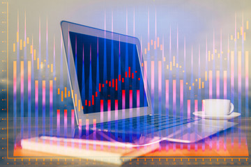 Financial graph colorful drawing and table with computer on background. Multi exposure. Concept of international markets.