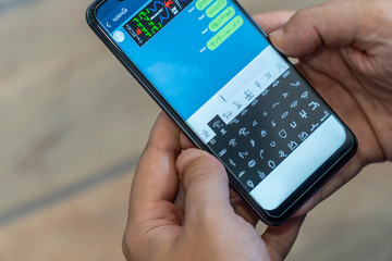 Writing alien messages with hieroglyphs on a smartphone