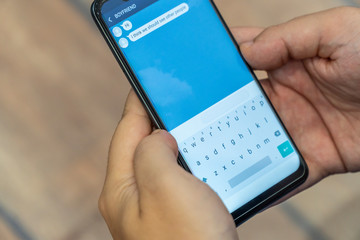 Homosexual realtionship break up concept - receiving a textl from boyfriend