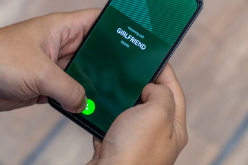 Man answering a call from his girlfriend