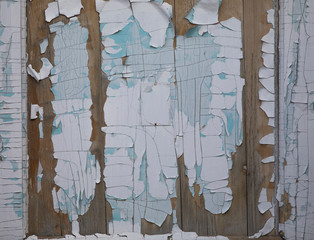 wood background with white cracked peeling paint