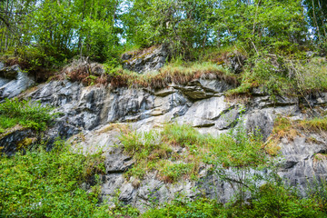 Fototapeta na wymiar Marble slopes surprise with their variegation and height. Karelia, Russia