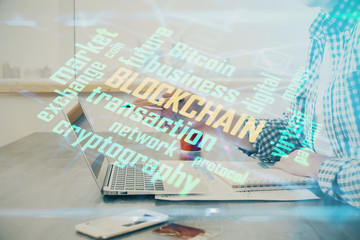 Blockchain theme hud with man working on computer on background. Concept of crypto chain. Double exposure.