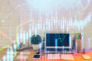 Financial chart drawing and table with computer on background. Multi exposure. Concept of international markets.