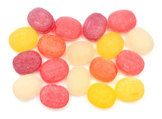 Multicolored sugar sweet sucking candy isolated on white background. Medical herbal lozenges. Flat lay, top view