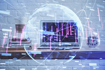 Financial chart drawing and table with computer on background. Multi exposure. Concept of international markets.