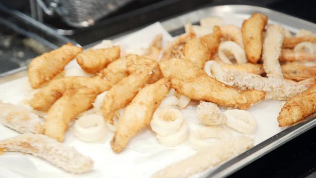 Seafood in a batter. Preparation of shrimp in batter. Squids in batter. Shrimps in batter. 