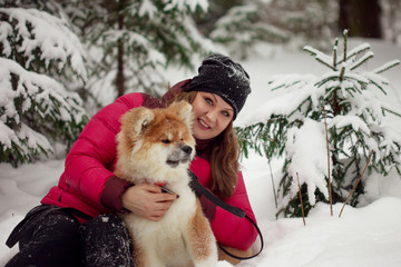 Portrait with a cute fluffy puppy. Winter walk with a dog.