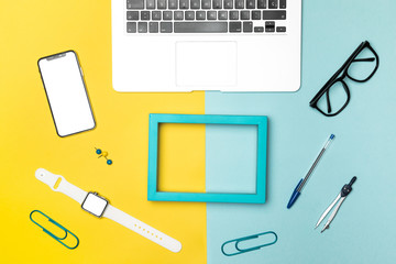 Flat lay desk conecpt with blue frame