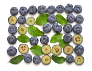 Blueberries fruit with leaves isolated on white background. Flat lay, top view