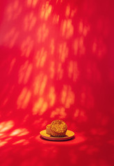 Chinese Mid-Autumn Festival cuisine, a dish of mooncakes on a red background