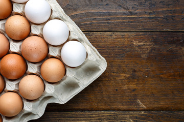 eggs in a tray on a wooden background