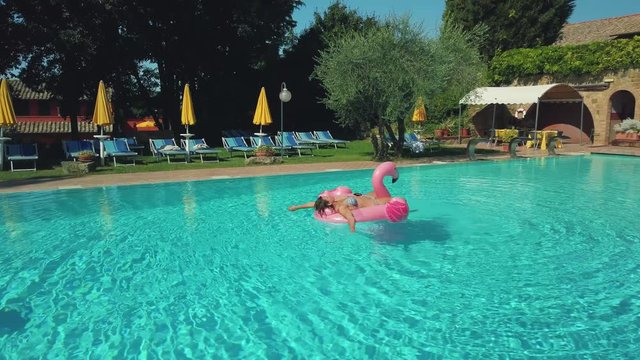 Young woman relaxing in pool