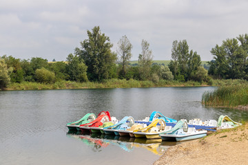 Multi-colored catamarans on the lake
