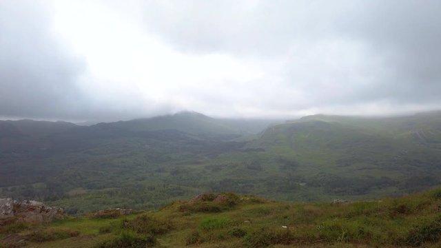 Misty wet Irish mountain valley landscape scenery off into distant horizon.