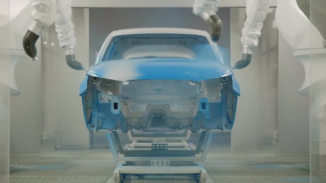 robots painted car body at car plant