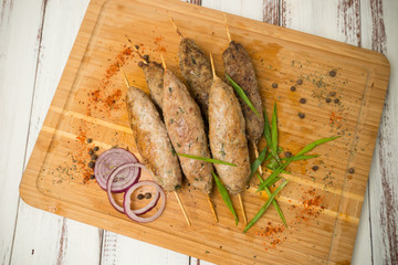 kebab. Fried meat on sticks.  - 284327591