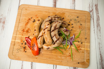 sausages for frying. fried sausages with vegetables - 284327599