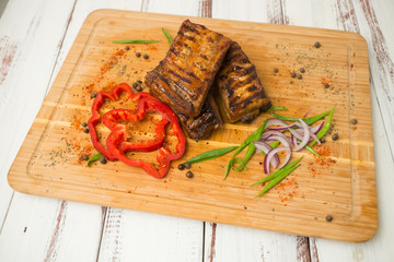 grilled ribs with vegetables. Pork. - 284327759