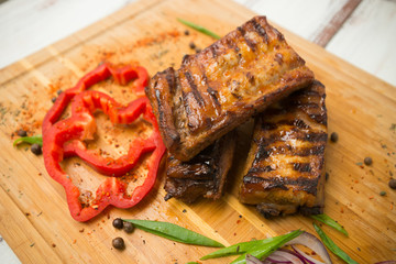 grilled ribs with vegetables. Pork. - 284327793