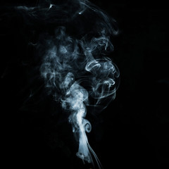 Abstract white smoke effect isolated on black background.