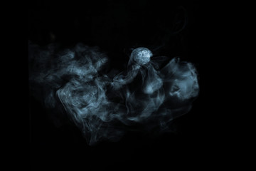 Abstract white smoke effect isolated on black background.