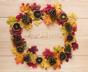 Top view autumn leaves on wooden table