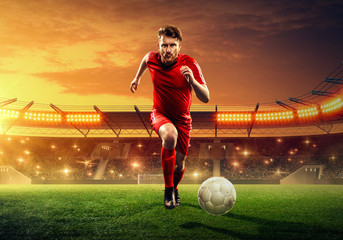 Soccer player in action on a stadium. Dribble the ball. Soccer game. Sports championship. Soccer field. - obrazy, fototapety, plakaty